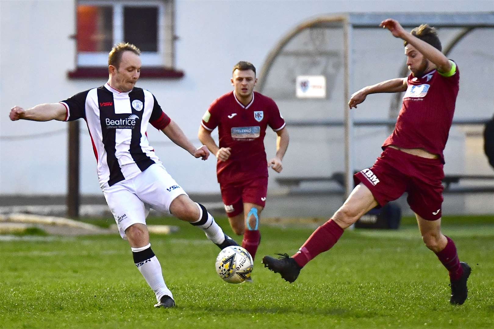 Wick midfielder Richard Macadie beats James Brownie to the ball at Kynoch Park. Picture: Mel Roger