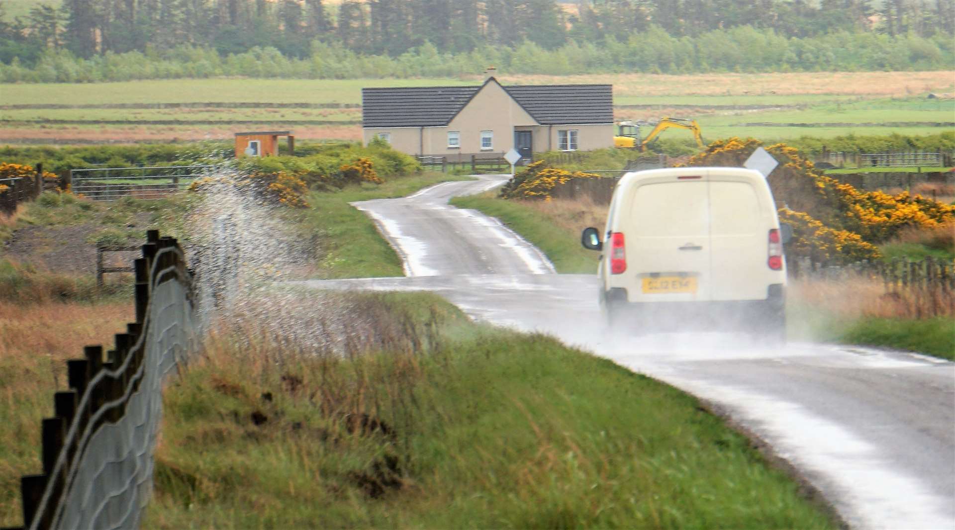 A van hits a puddle and sends up a huge cascade of water that could potentially soak a pedestrian. Picture: DGS