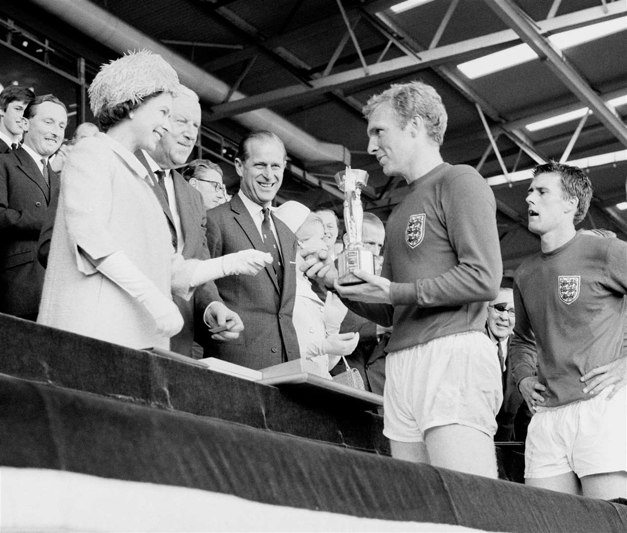 Queen Elizabeth II attended the 1966 World Cup final, presenting Bobby Moore with the trophy (PA)