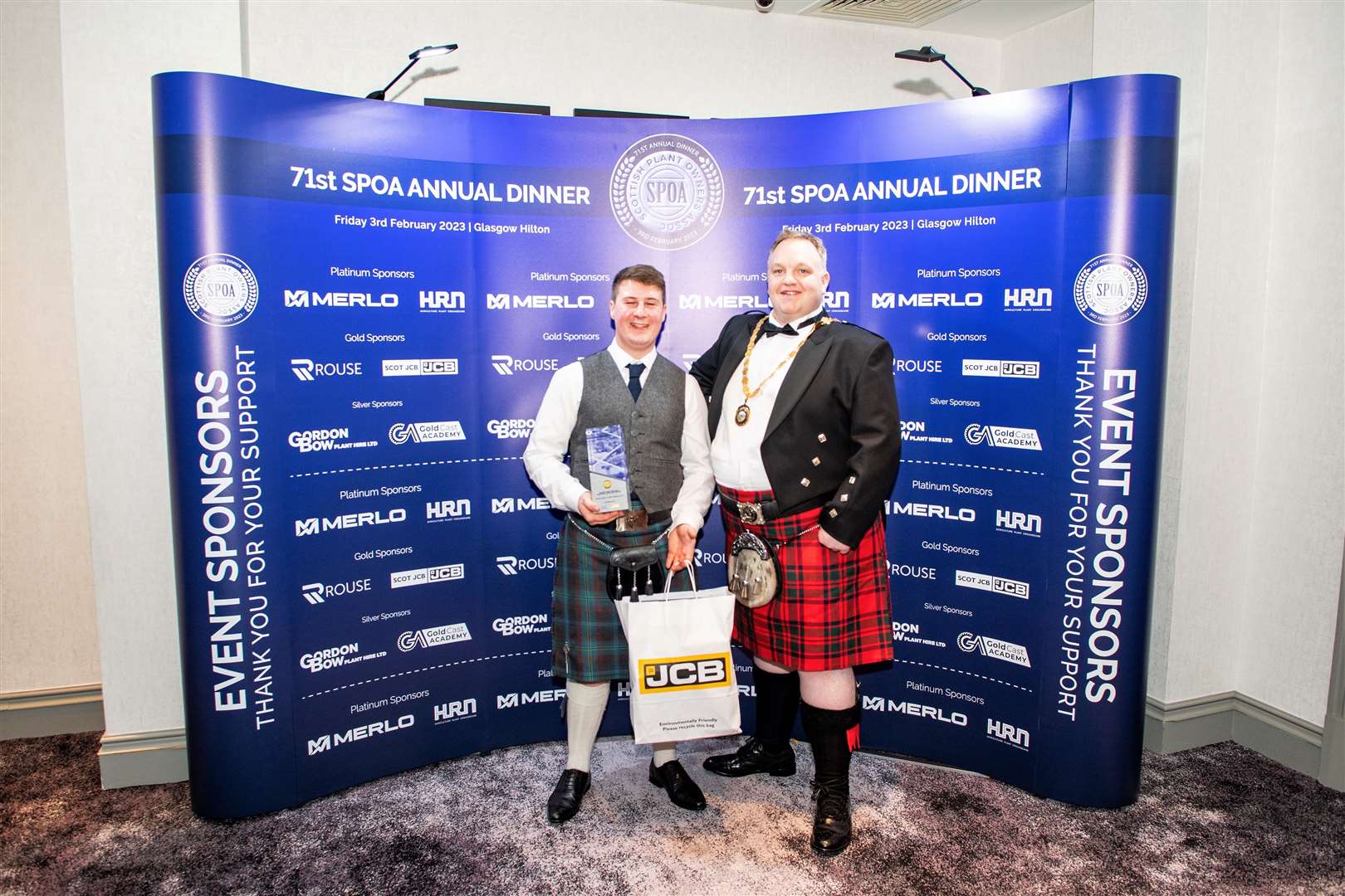 Andrew Manson (left) with Callum Mackintosh, president of the SPOA. Picture: Scottish Photography Productions