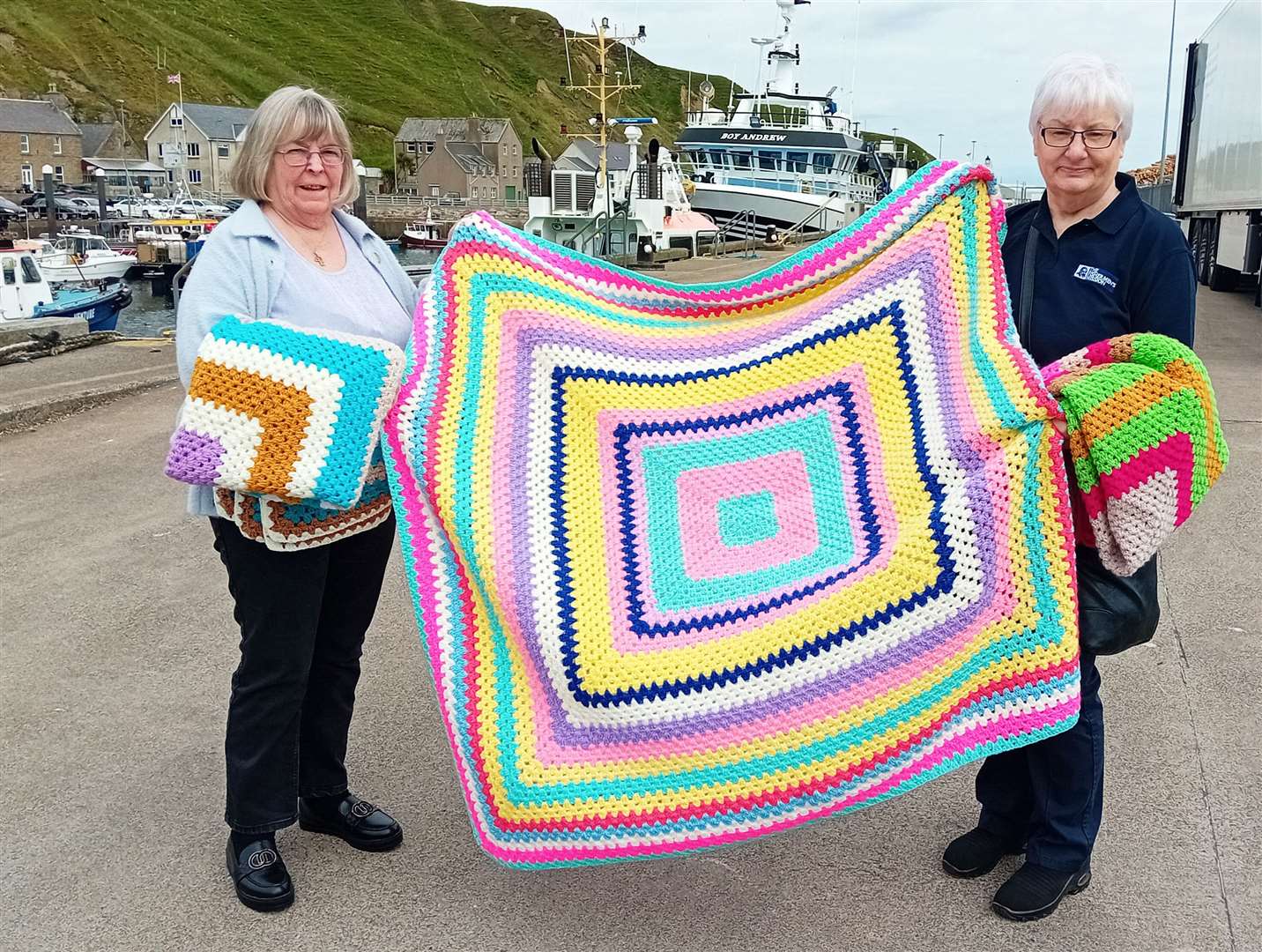 Jackie Dodds (right), the Fishermen's Mission area officer for Caithness and Orkney, accepting the blankets from Carol Phillips at Scrabster harbour. Picture: Willie Mackay
