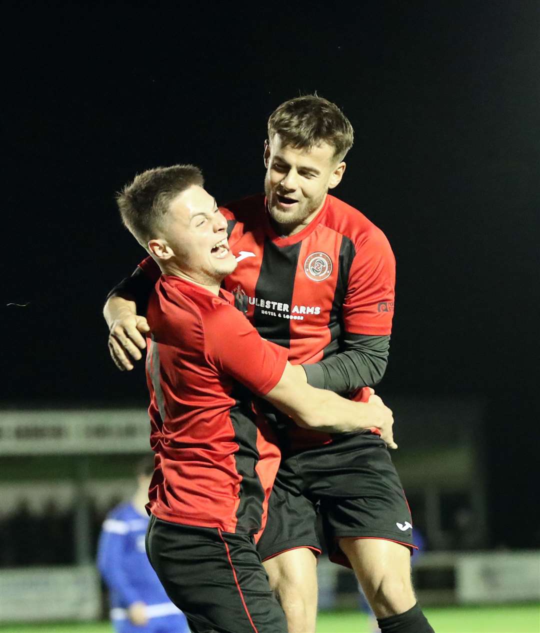 Jonah Martens (right) congratulates James Mackintosh after Halkirk United's second goal. Picture: James Gunn