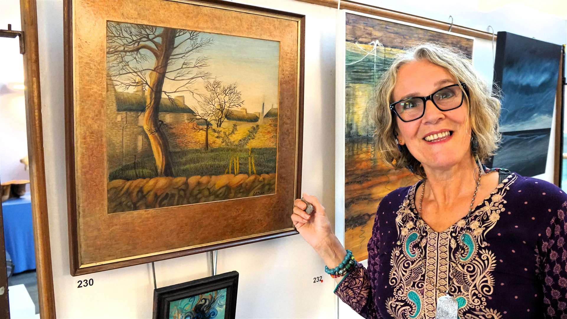 Caroline Swan with the painting she sold 30 years ago and bought in a Wick charity shop for 30p. Picture: DGS