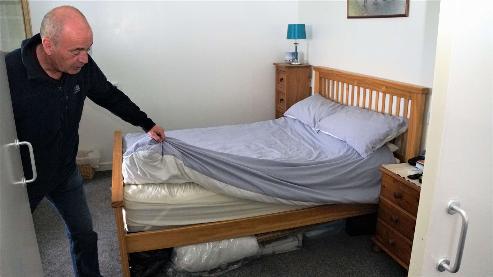 Sheets and other items stored under his bed are wrapped in plastic to avoid dampness. Picture: DGS