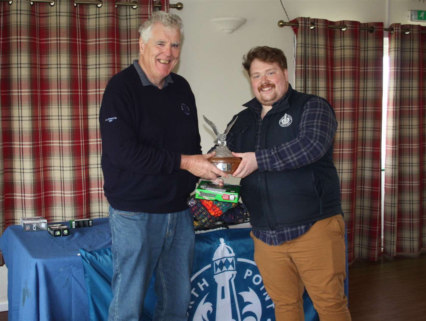 Alex Anderson (left) receives the senior winter eclectic prize from Alex MacDonald of North Point Distillery.