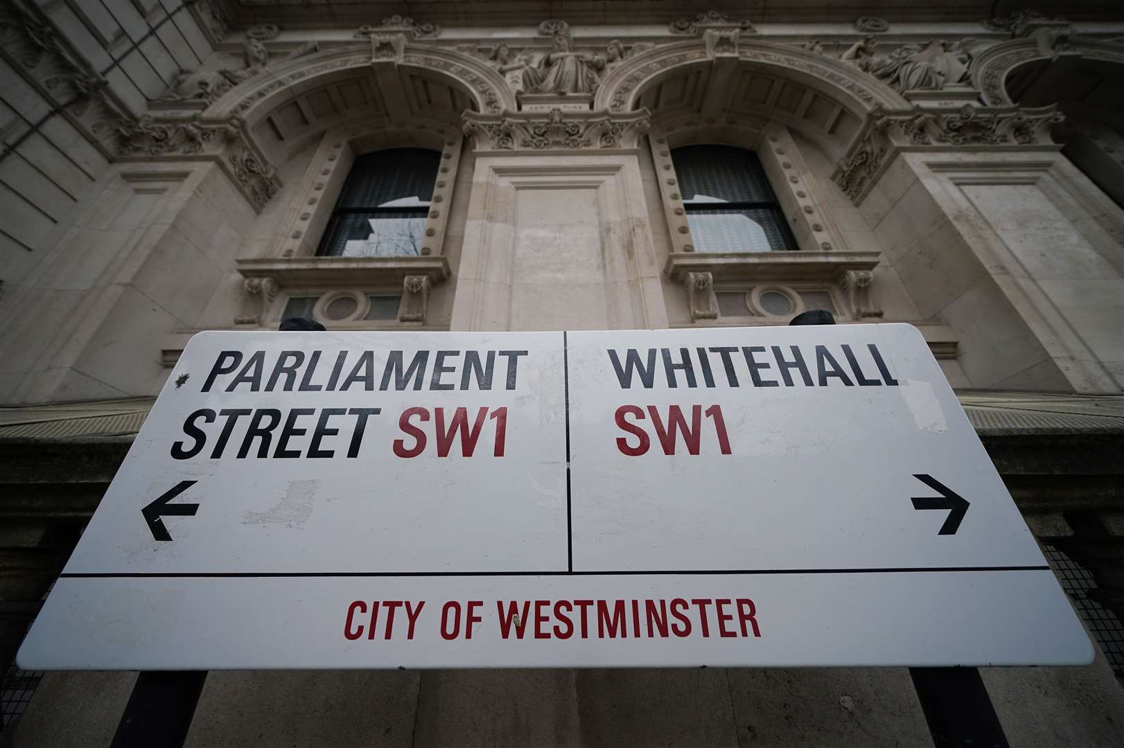 A street sign giving directions to Parliament Street and Whitehall in London, England (Yui Mok/PA)