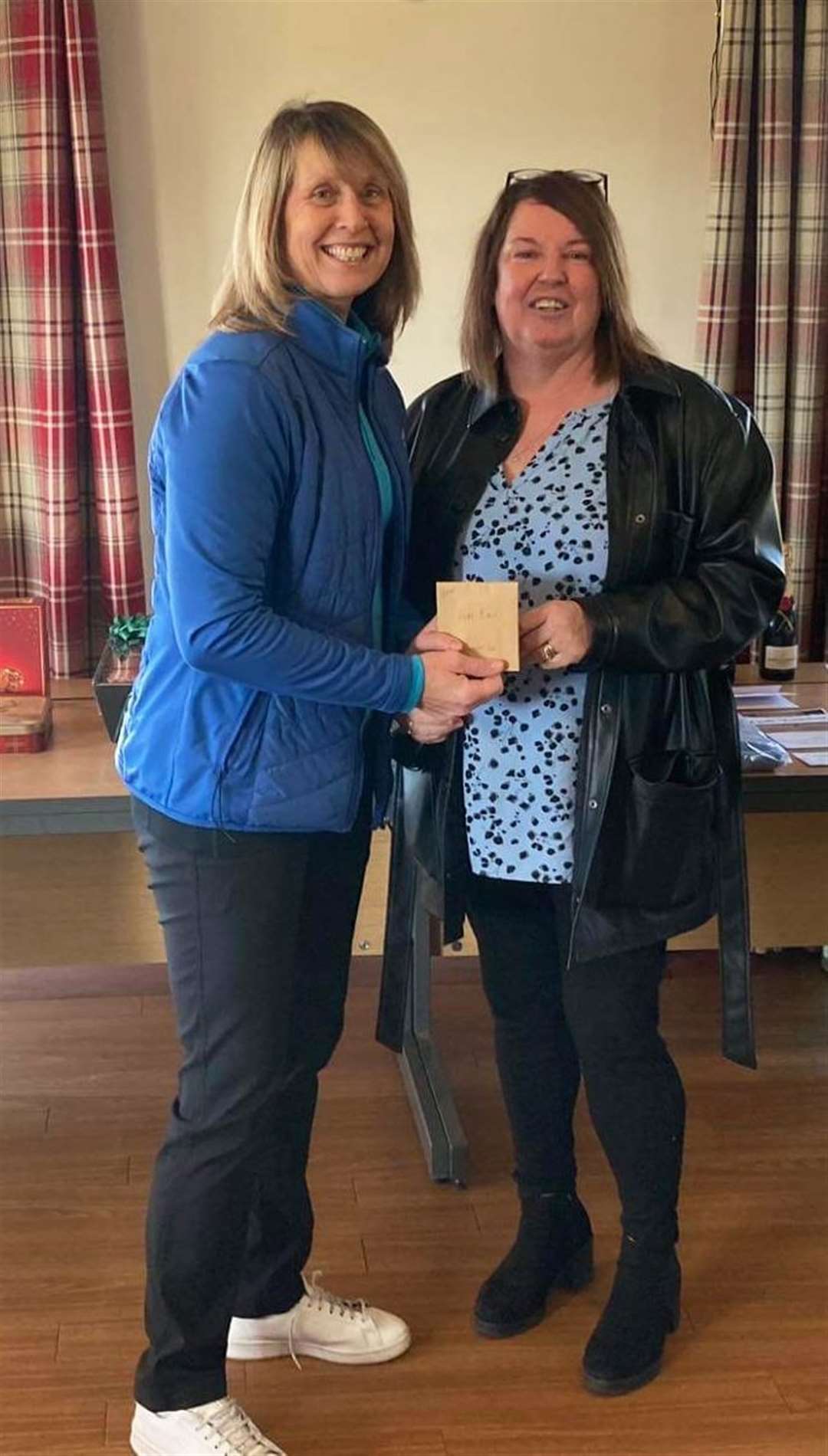 Pam Bain receiving her runner-up prize from Maryjane.
