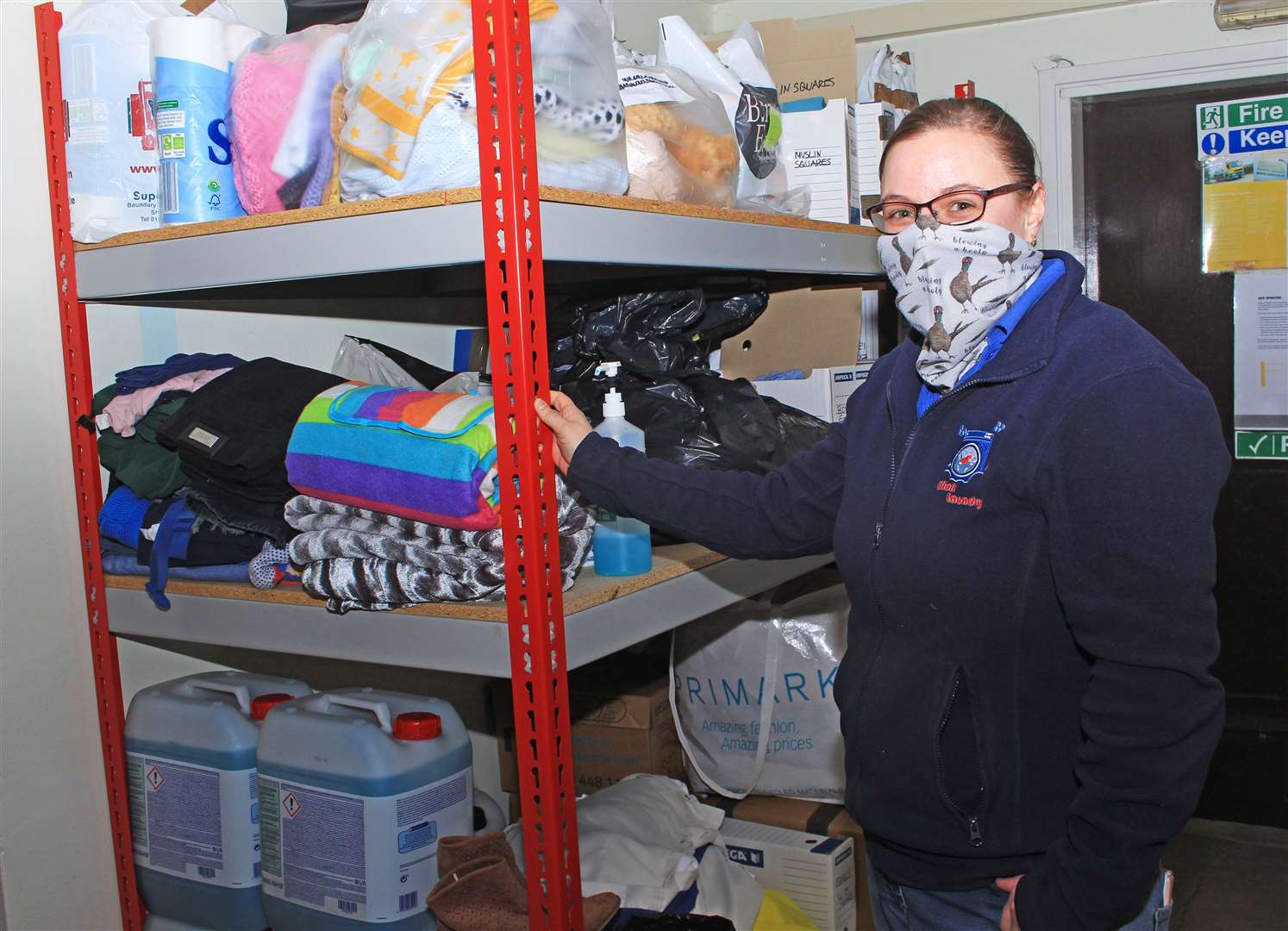 Caitlin Mowat beside some of the items that have been handed in at Wick Laundry this week. Picture: Alan Hendry