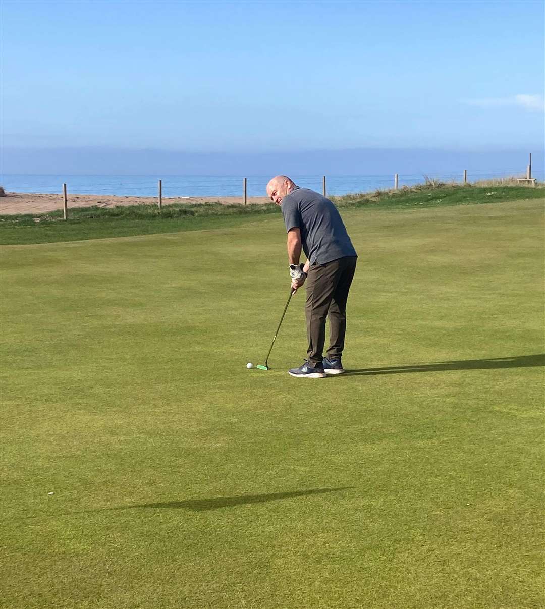 Willie Steven, winner of the overall nett competition at the NC500 Links Open, putting on the fourth green.