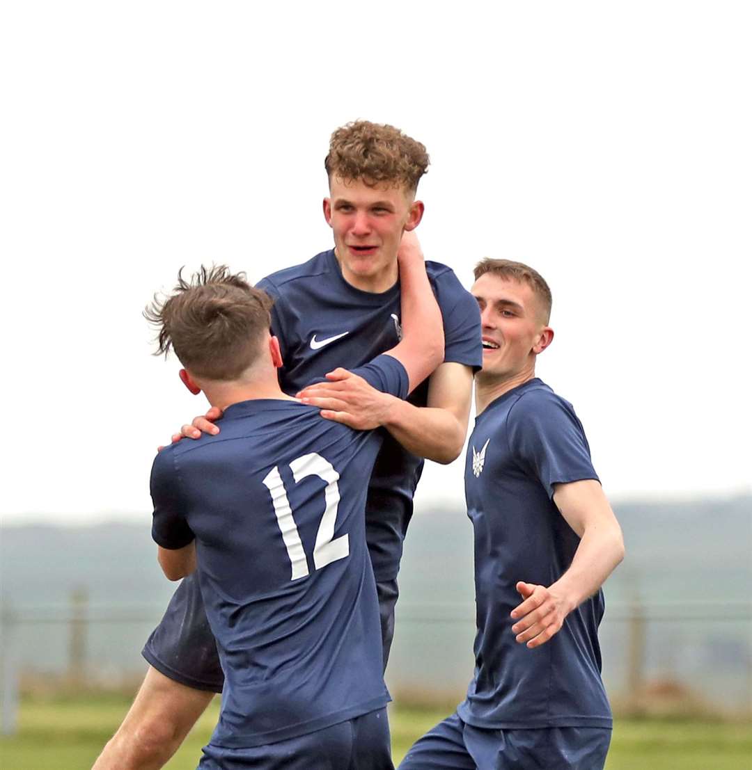 Goalscorer Mark Munro is congratulated by Will Cannop and Aaron Wilson. Picture: James Gunn