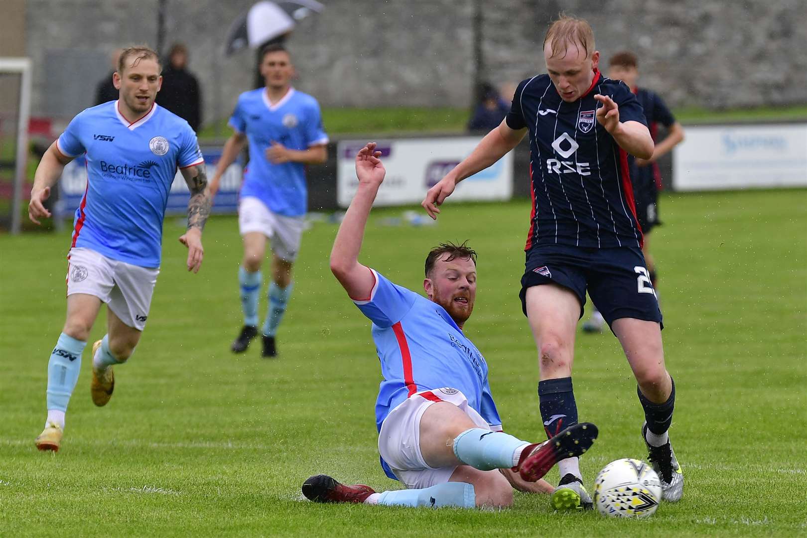 Wick's Rob McLean stretches to tackle Ross County's Ethan Kevill in a pre-season friendly. Picture: Mel Roger