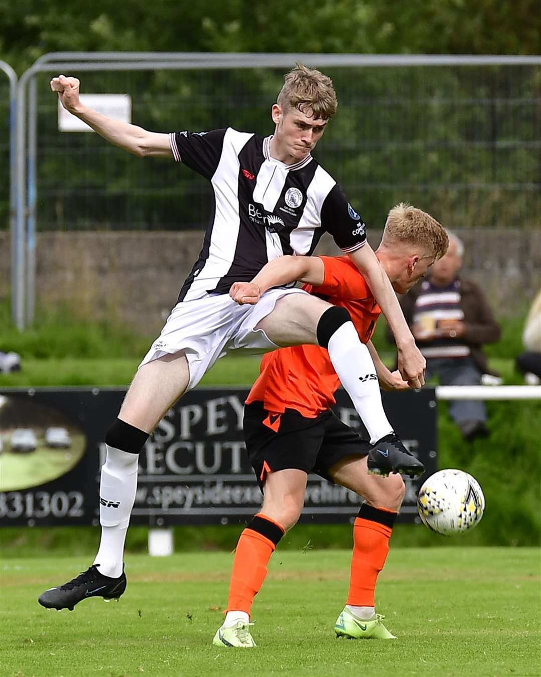 Wick Academy teenager Joe Anderson gets to the ball ahead of Rothes goalscorer Ross Gunn. Picture: Mel Roger