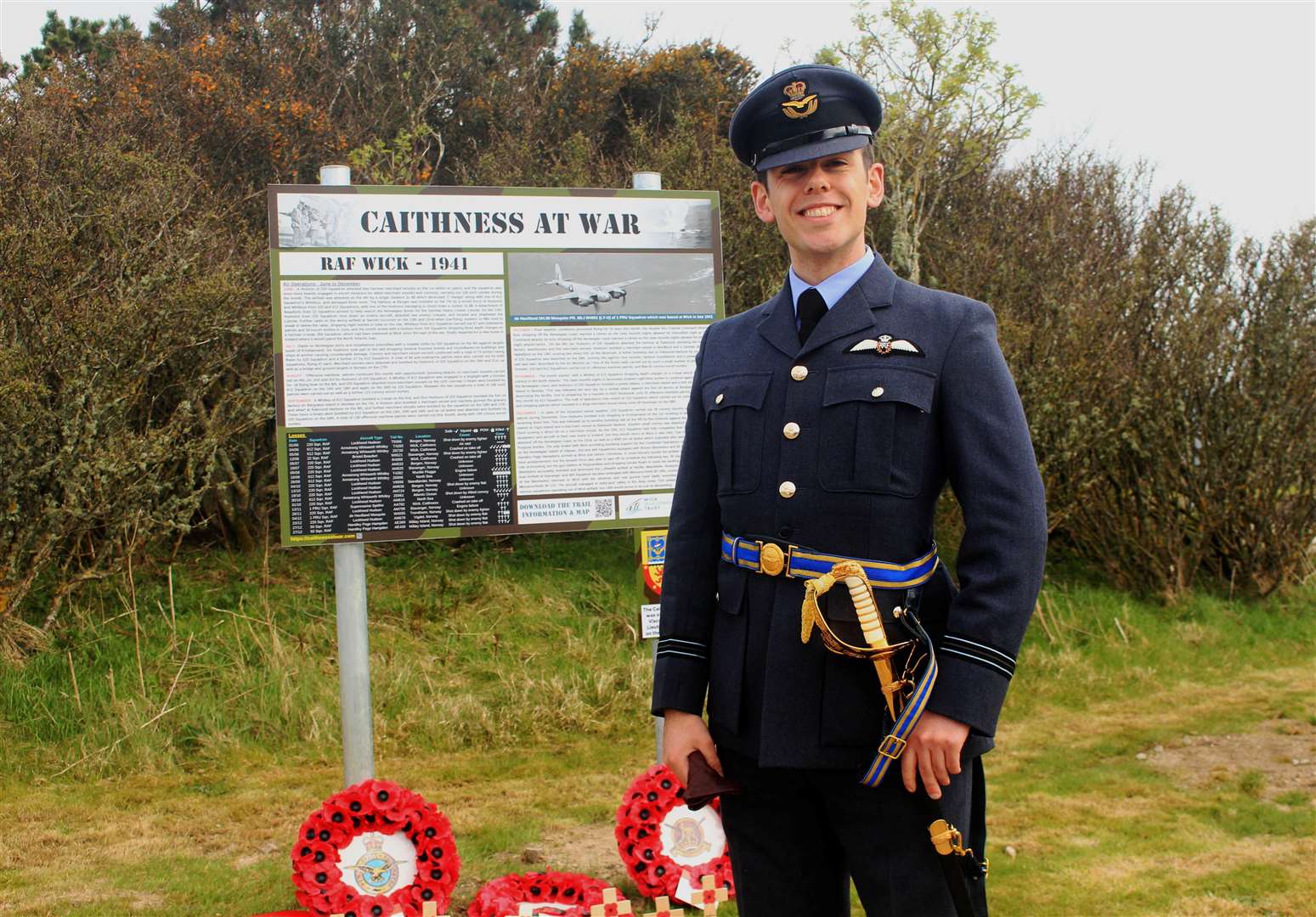 After the formal proceedings were over, Flight Lieutenant Calum Falconer, of 6 Squadron at RAF Lossiemouth, took time to read the Caithness At War information panels at the Wick airport entrance. Picture: Alan Hendry