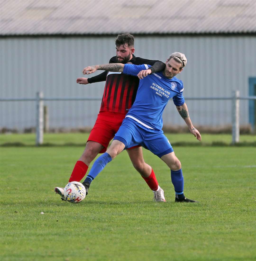 Liam Bremner (right) in a tussle with Halkirk United defender Ryan Sutherland while playing for Golspie Sutherland in a North Caledonian League match at Morrison Park in October. Picture: James Gunn