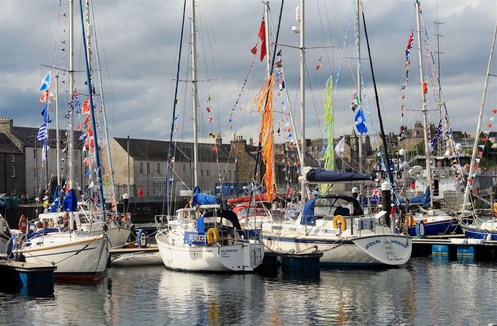 Colourful flags on the yachts added to the spectacle at Wick harbour. Picture: Alan Hendry