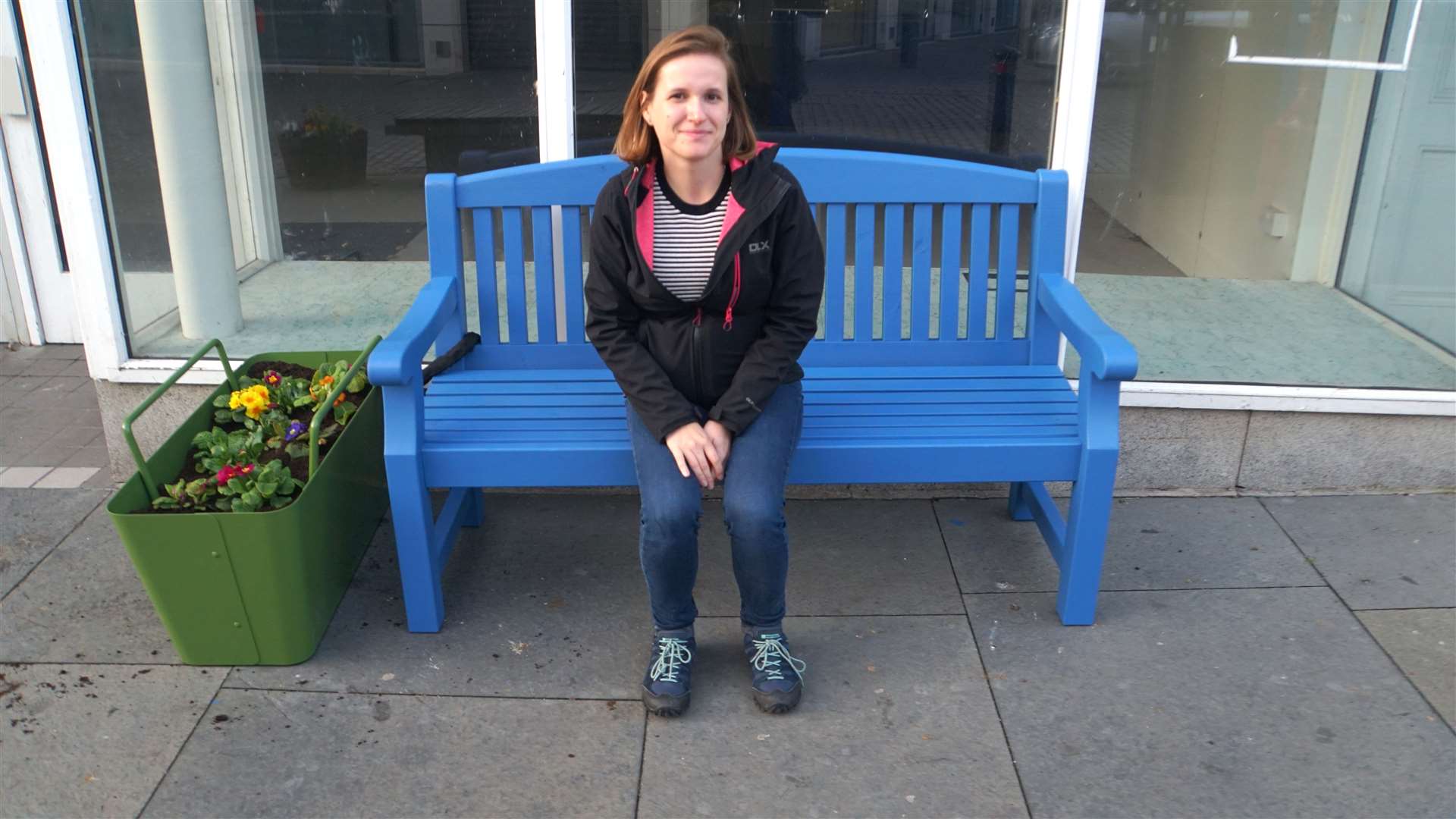 Kasia Koziel, who headed up the Sustrans team visiting Wick last week, sits on a bright blue bench that was painted up to bring a touch of colour to the town centre.