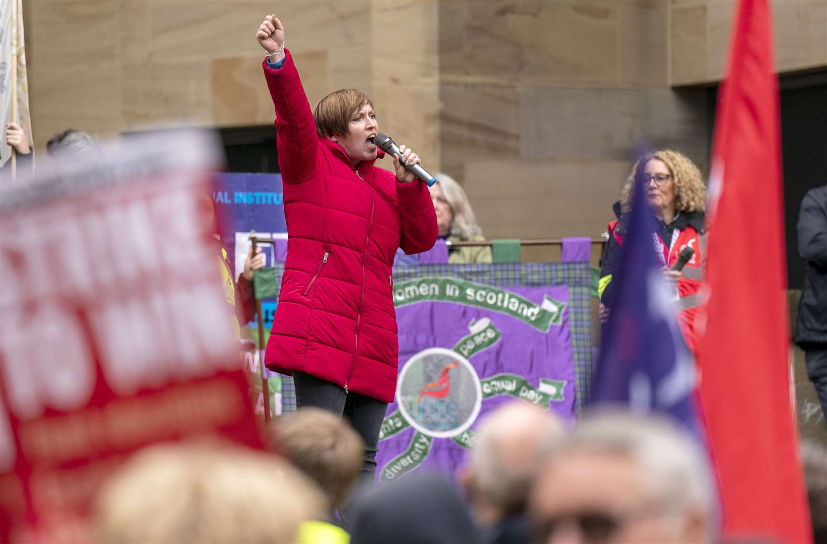 STUC general secretary Roz Foyer speaks to lecturers and other university staff at a rally in Glasgow (Jane Barlow/PA)