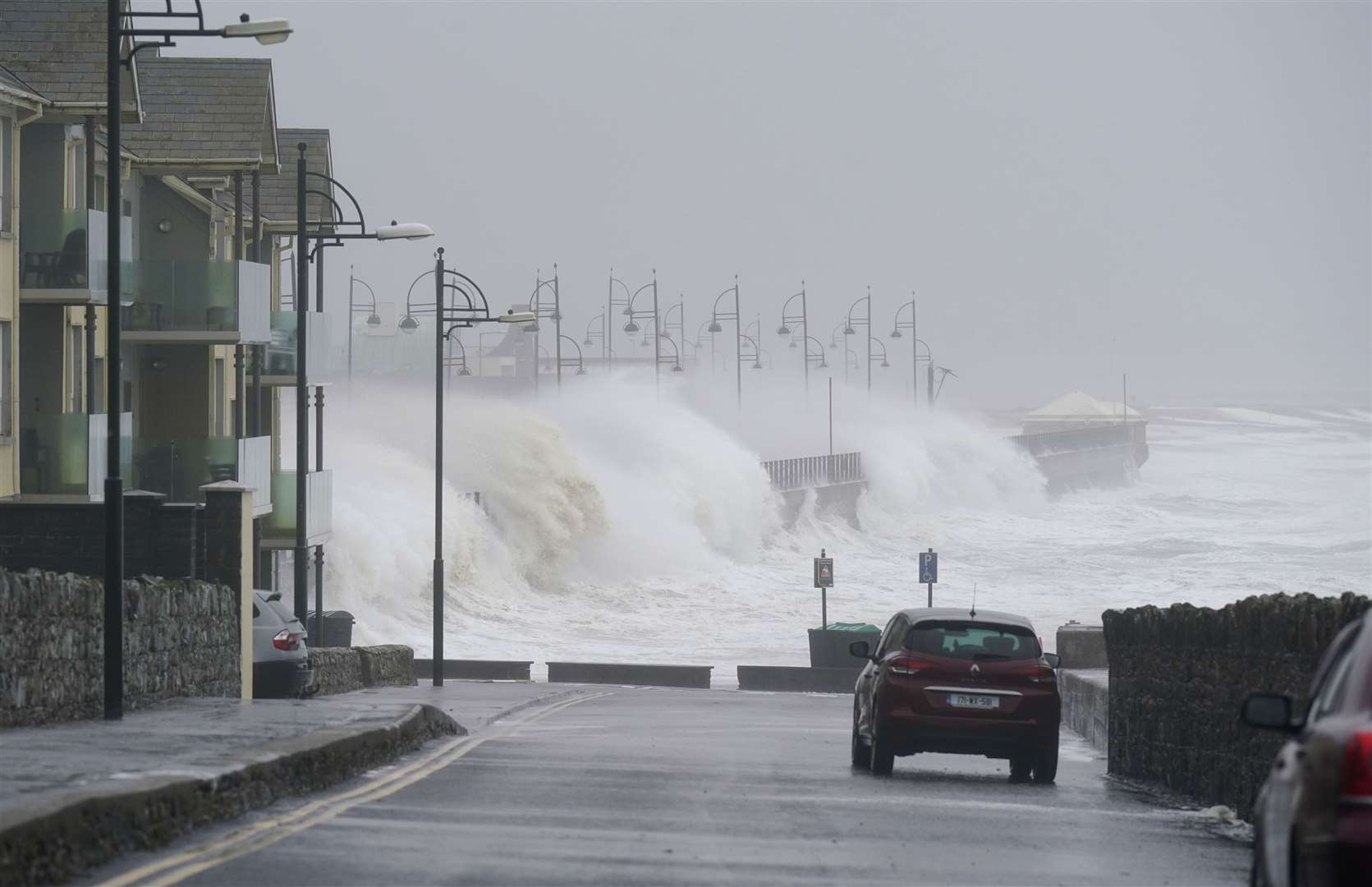 Waves at high tide in Tramore in Co Waterford (Niall Carson/PA)