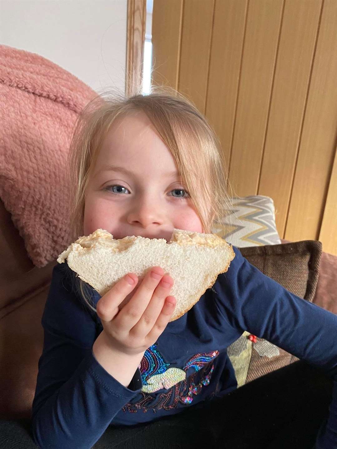 Dan's grand-daughter Carla having a sandwich – before the scorries get it!