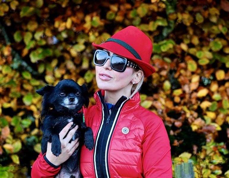 Natalie Oag with her purple poppy along with her dog Louis.