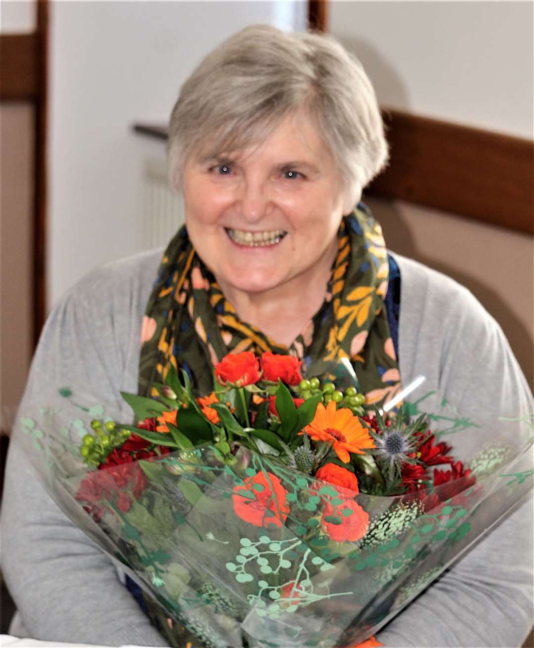 Kathy Wares with a bouquet of flowers presented by the Caithness Family History Society. Picture: Eswyl Fell