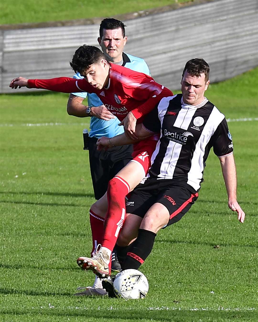 Wick forward Gordon MacNab gets his foot to the ball despite the close attentions of Brechin City's Jack Milne. Picture: Mel Roger