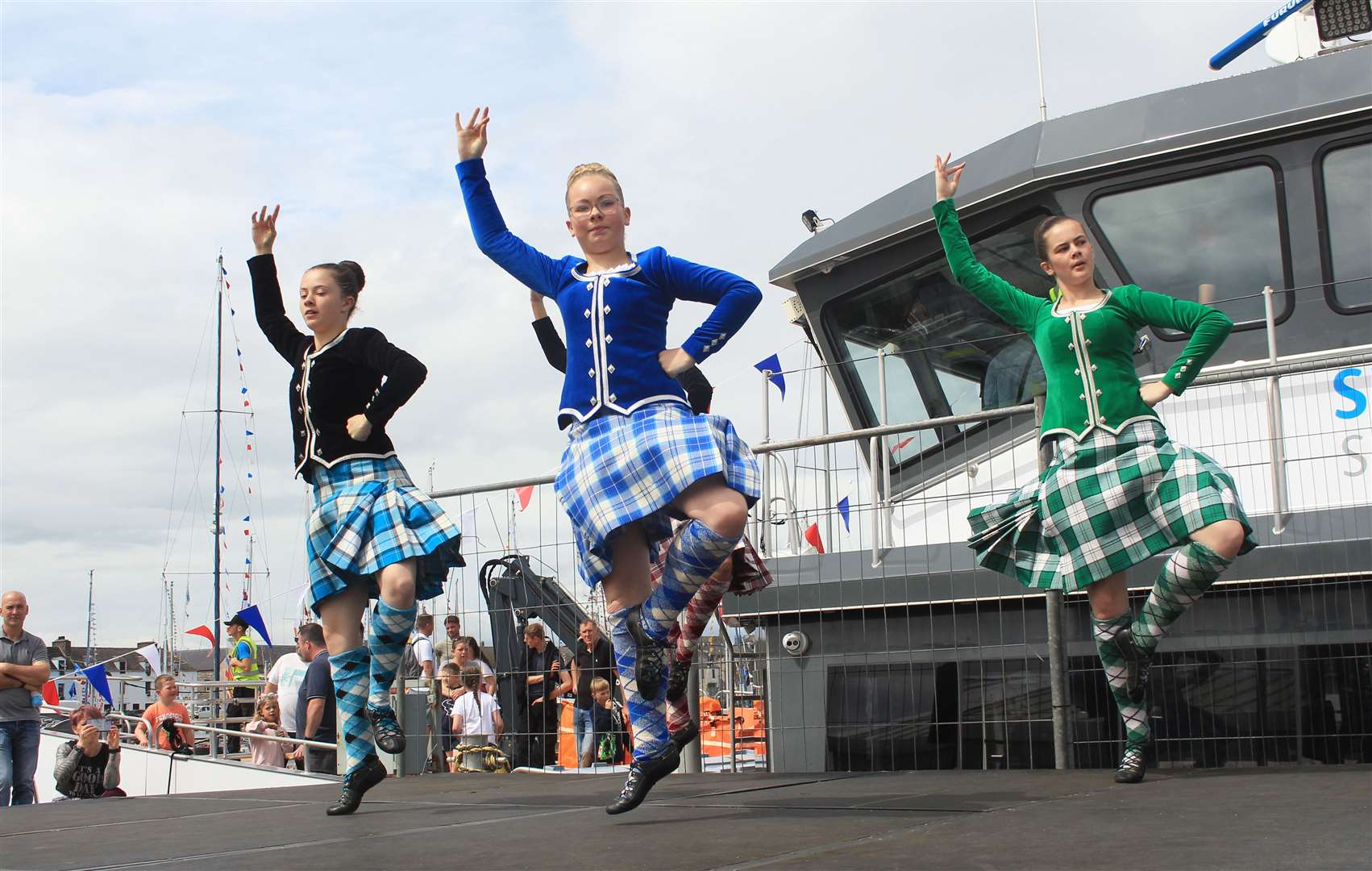 Three of Elise Lyall's Highland dancers entertaining the crowd. Picture: Alan Hendry