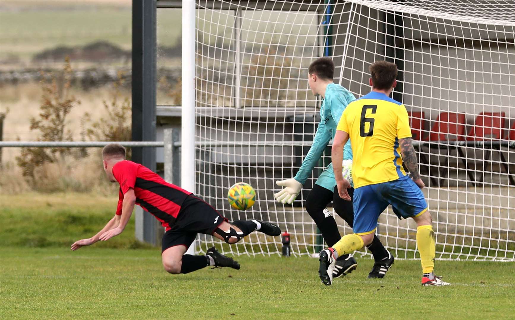 Grant Aitkenhead heads in the fifth goal for Halkirk United against Orkney. Picture: James Gunn