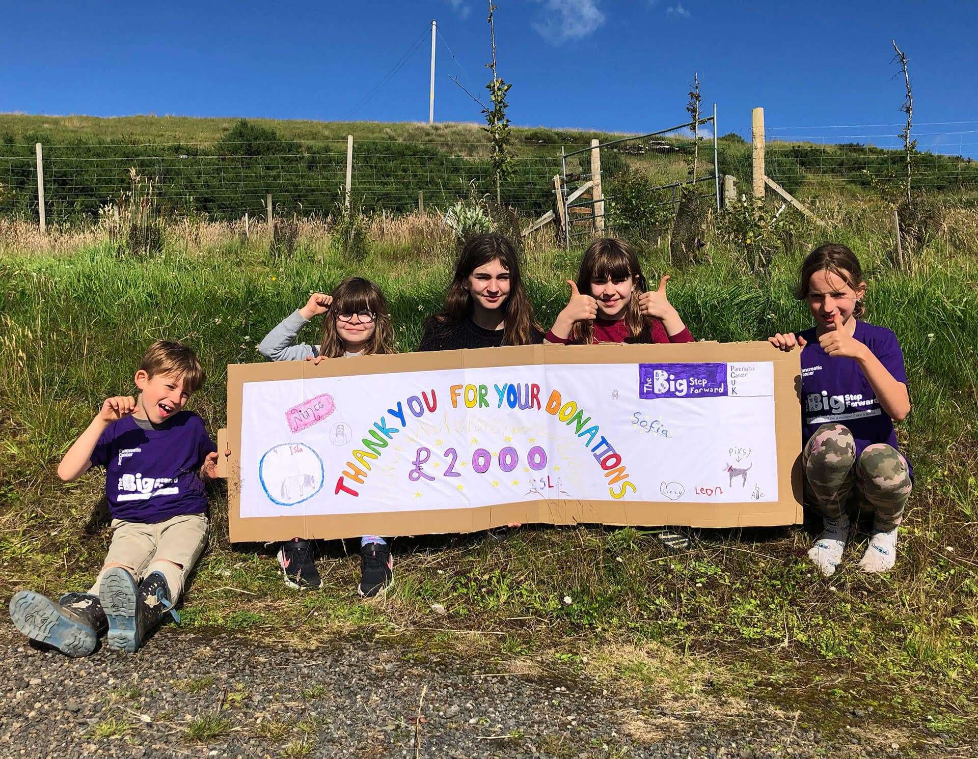 After the walk the grandchildren wanted to thank all the people who had donated by making a banner. From left: Leon Spirit-Hawthorne (7), Lizzie Fell Cano (8), Sofia Fell Cano (12), Isla Fell Cano (10) and Nina Spirit-Hawthorne (9).