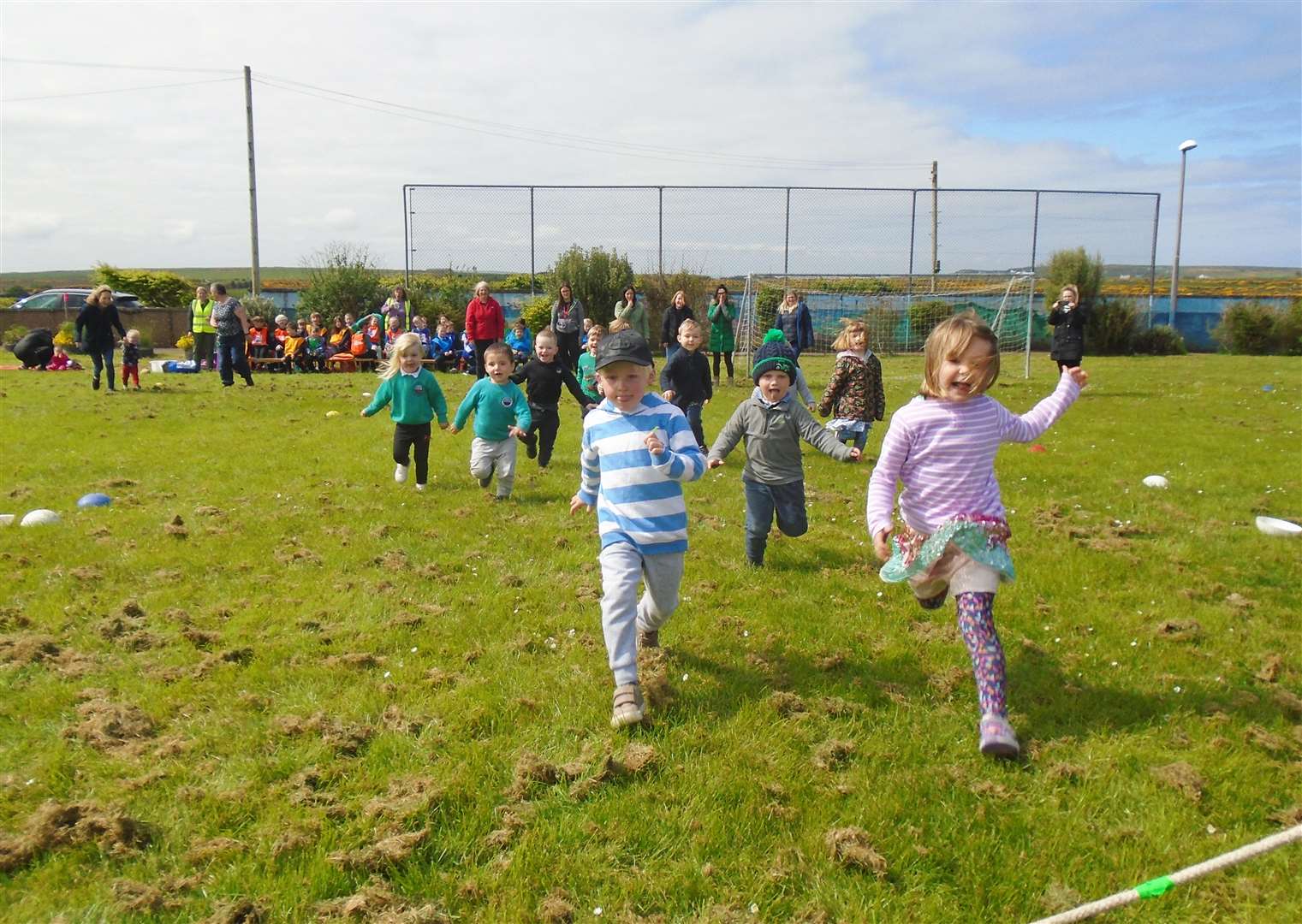 Nursery children competing in their running race at Crossroads.