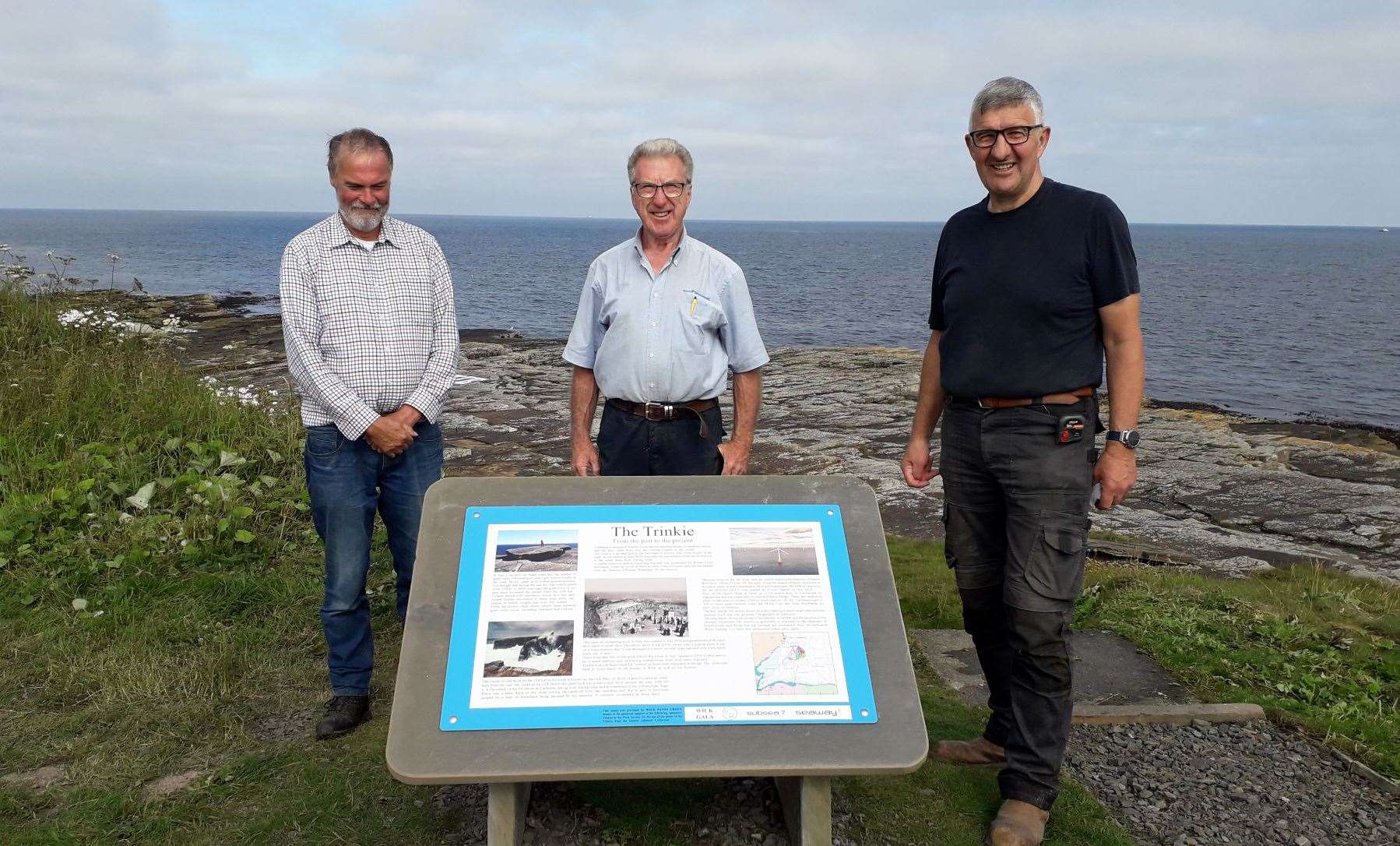 David Mackay (left), who designed and manufactured the new signs, with Wick Paths Group members and Graham Begg and Willie Watt at the Trinkie. Pictures: Wick Paths Group