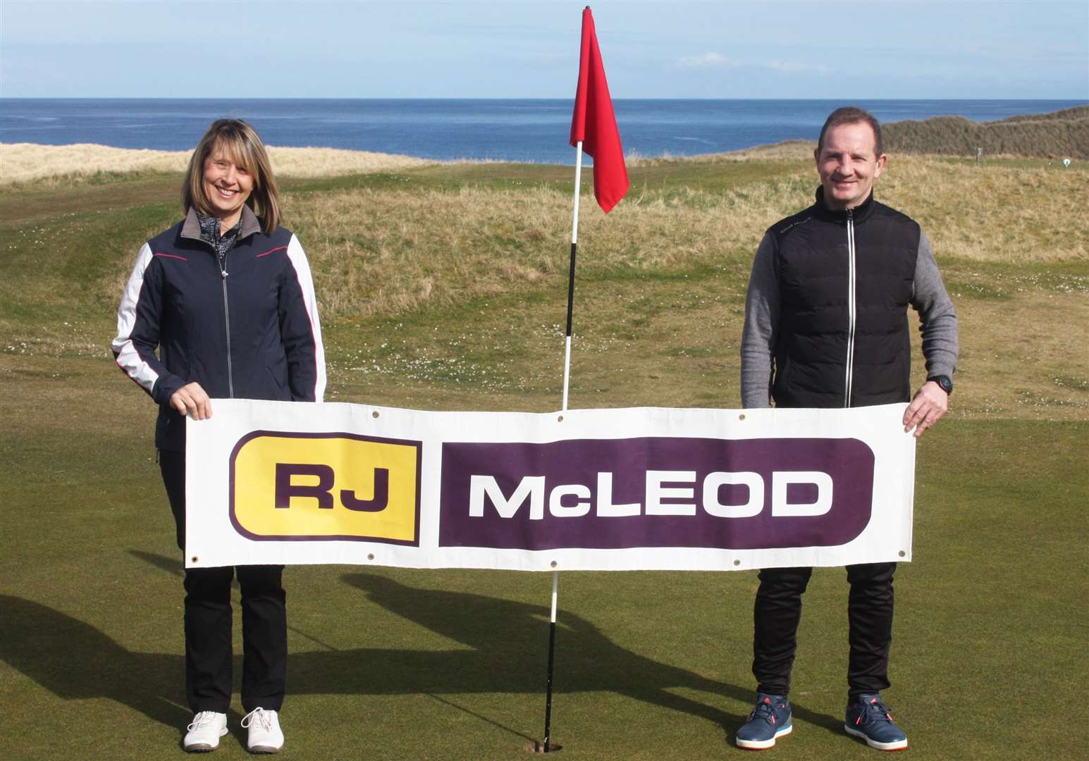 Pam Bain (left), one of the winners in the recent RJ McLeod Open Scramble hosted by Reay Golf Club, pictured with club captain Andy Bain. Pam's team-mates were Graeme Henderson (Thurso) and James Howden (Wick).