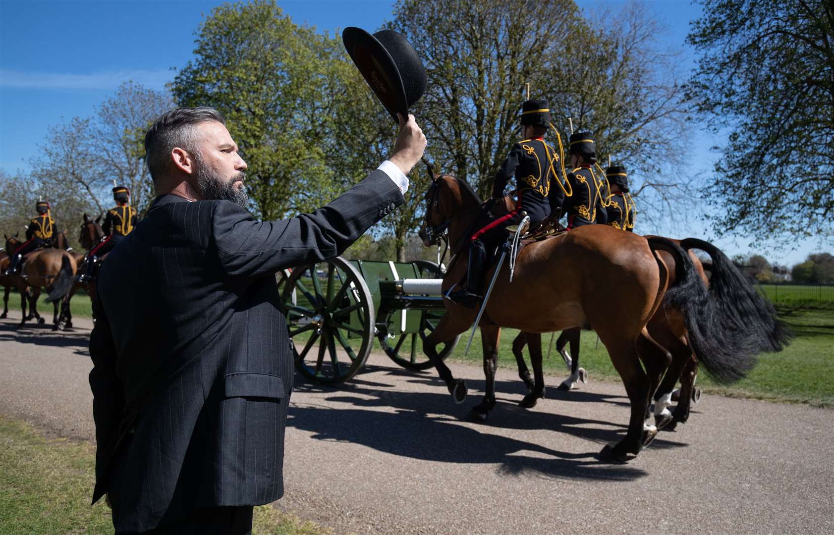 A man salutes the King’s Troop Royal Horse Artillery (Andrew Matthews/PA)