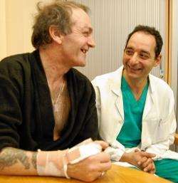 Donald Gunn and consultant plastic surgeon Amir Tadros share some light-hearted banter after the surgery.