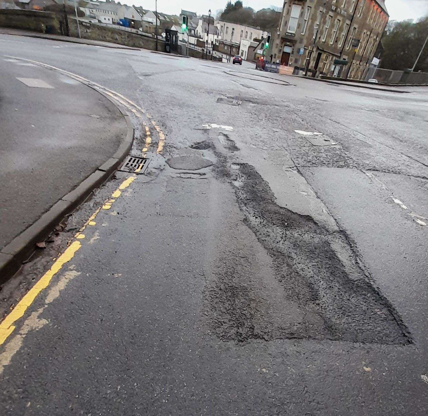 One of a number of potholed areas in Wick's Station Road. Picture: RBWCC