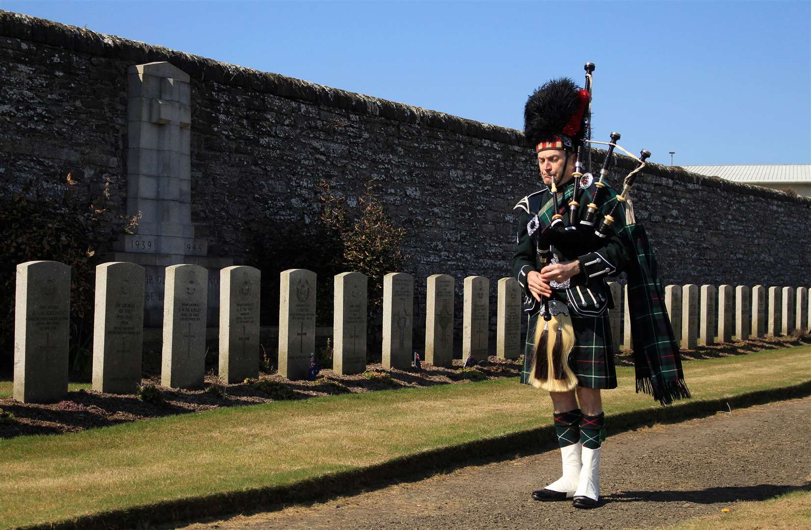 Piper Gordon Tait playing a lament during the Anzac Day ceremony at Wick cemetery in 2021, honouring Australian and New Zealand servicemen. Picture: Alan Hendry