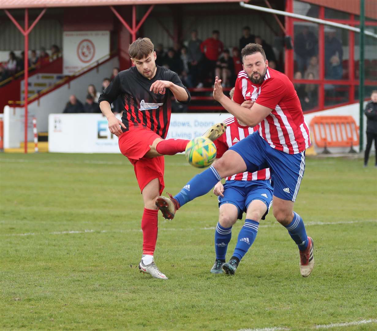 St Duthus defender Duncan Davidson blocks a shot by Halkirk's Jonah Martens. Picture: James Gunn