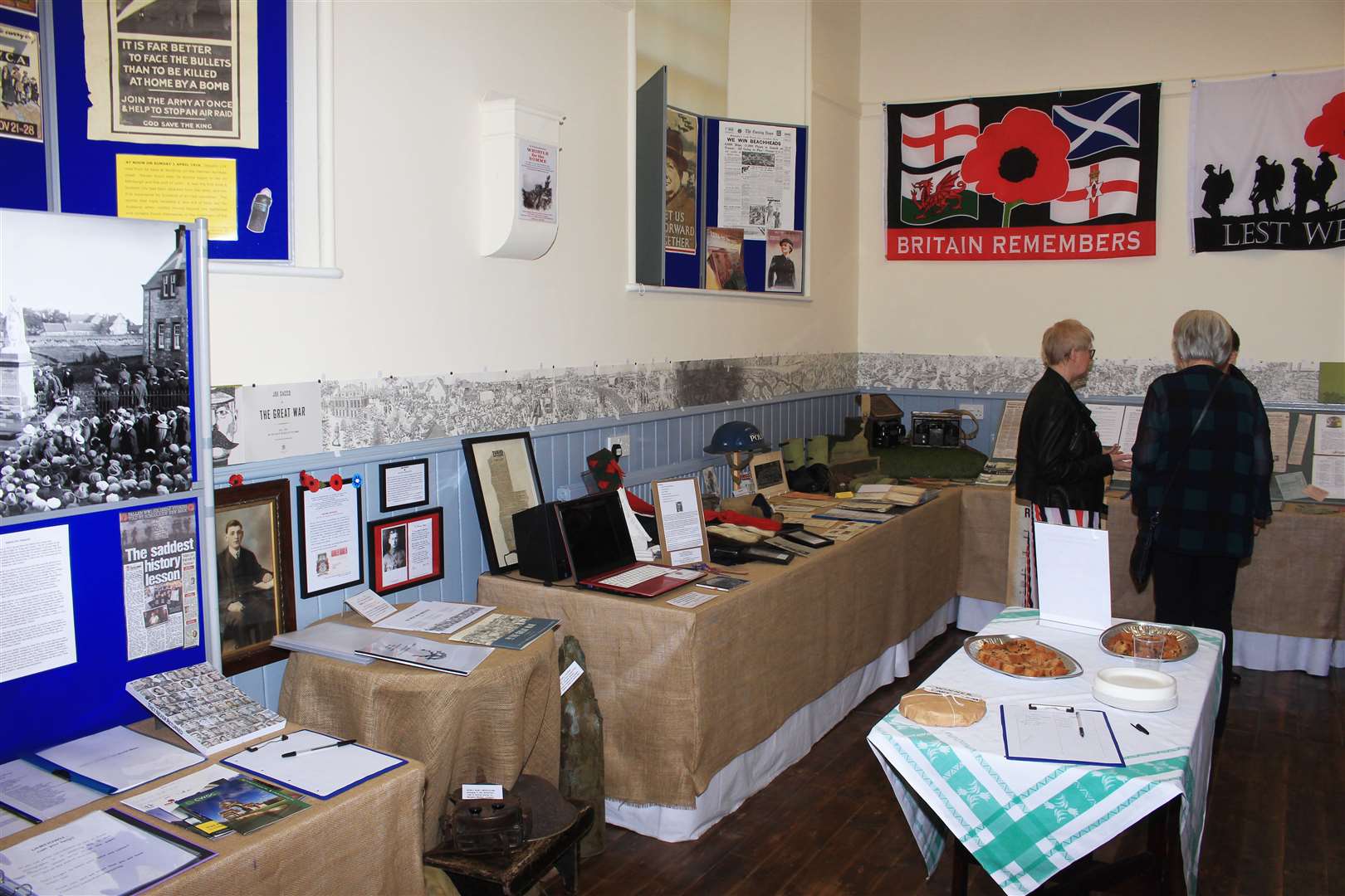 Visitors discussing some of the war exhibits.