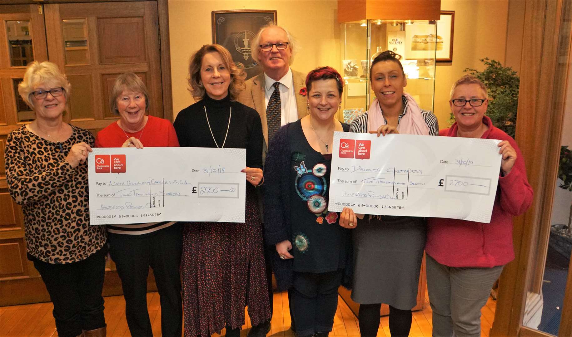 The handover of charity cheques at Mackays Hotel with (from left) Jean Dunnet and Barbara Cormack from the North Highland Cancer Information and Support Centre, Ellie Lamont and Murray Lamont from Mackays Hotel, Carole Darmady from Dyslexia Scotland Caithness branch, Jennifer Lamont from Mackays, and Carole Price from the dyslexia charity. Picture: DGS