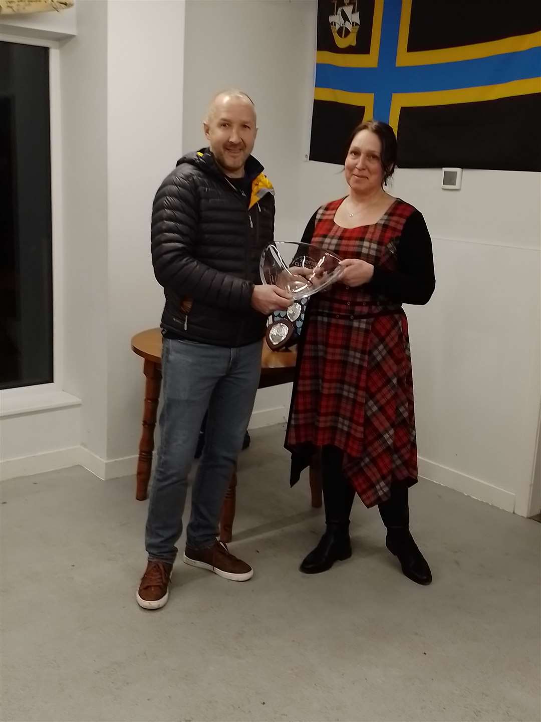 David Blackwood receives the Caithness service-to-sport award on behalf of his father Peter from Scottish Club Sport's vice chair Jackie Smith. Peter has not been keeping the best of health recently and was unable to attend the ceremony