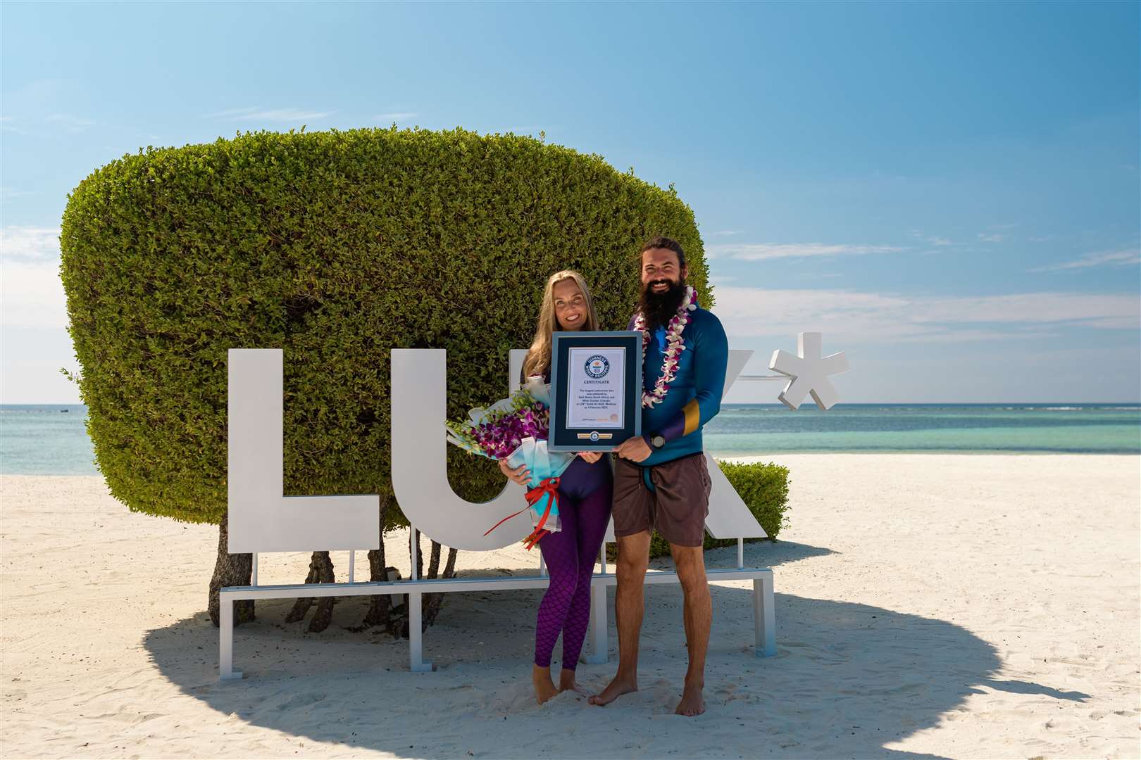 Beth Neale and Miles Cloutier with their Guinness World Record certificate (Photo Fanatics/Guinness World Records)