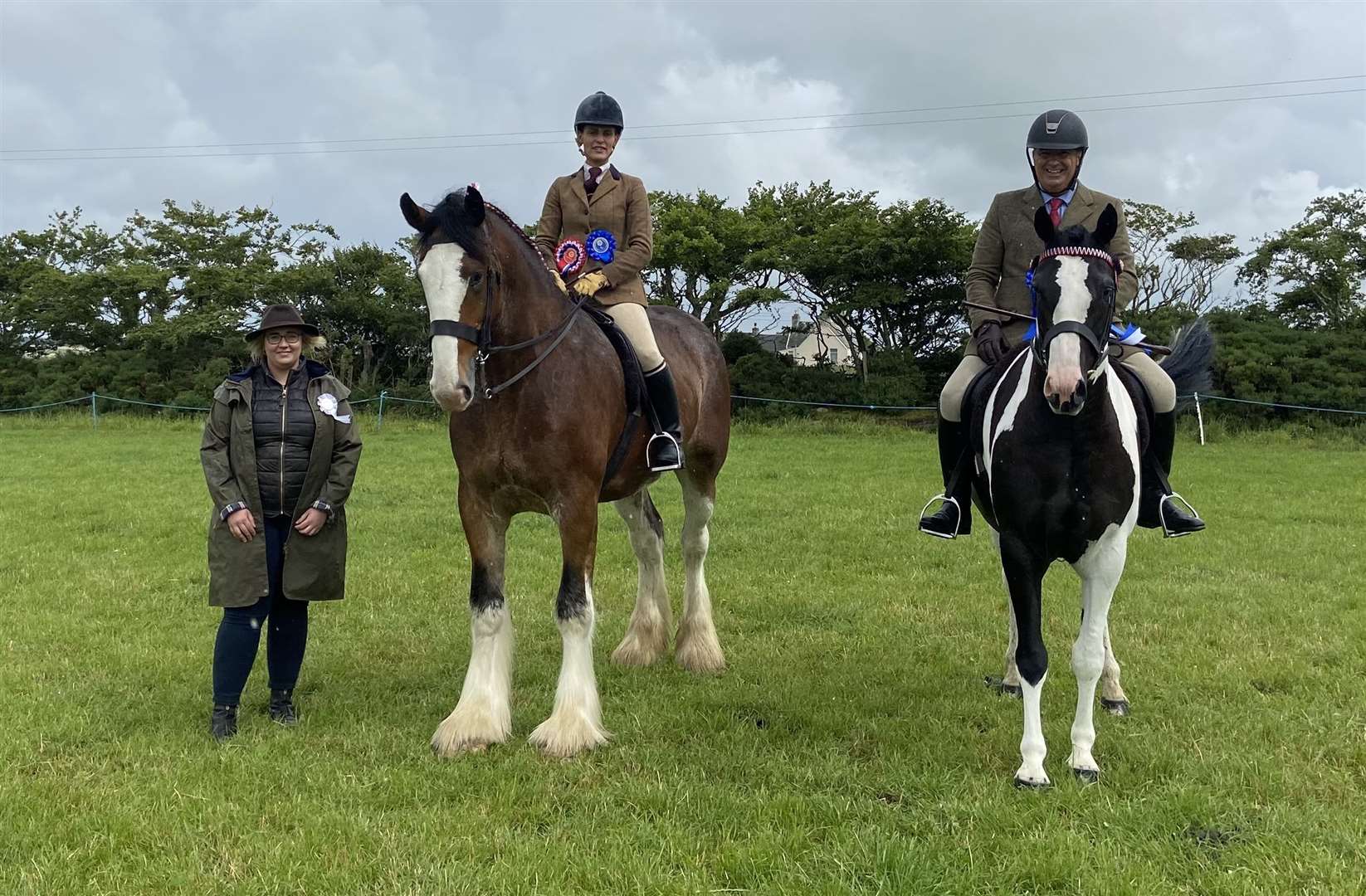Ridden champion Isla Miller and her Clydesdale Ha Durran Harry, along with reserve James Munro riding Independent Boy and judge Susan Noble.