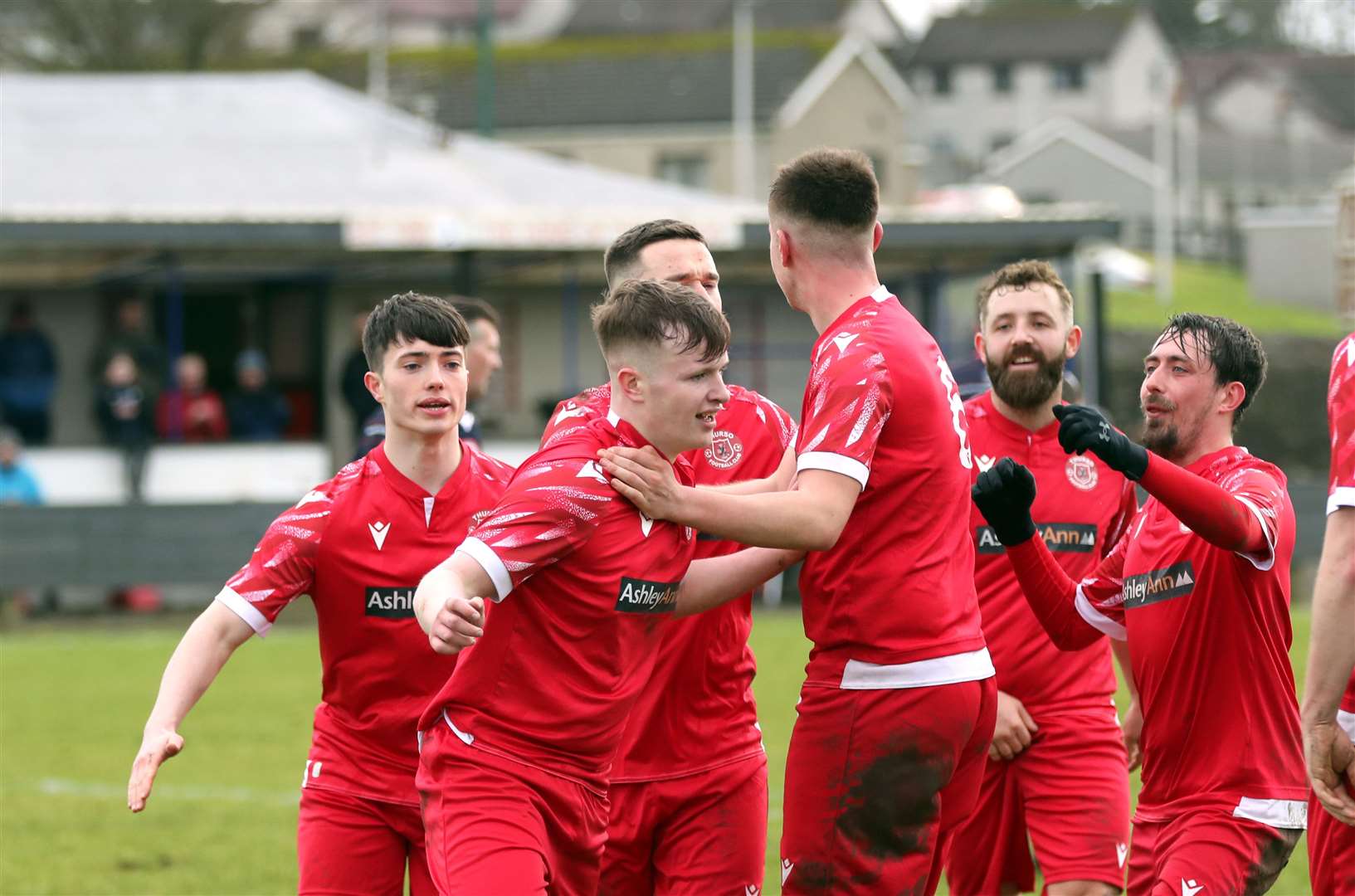 Lewis Mackillop takes the acclaim of team-mates after his late winner against Inverness Athletic at the Dammies. Picture: James Gunn