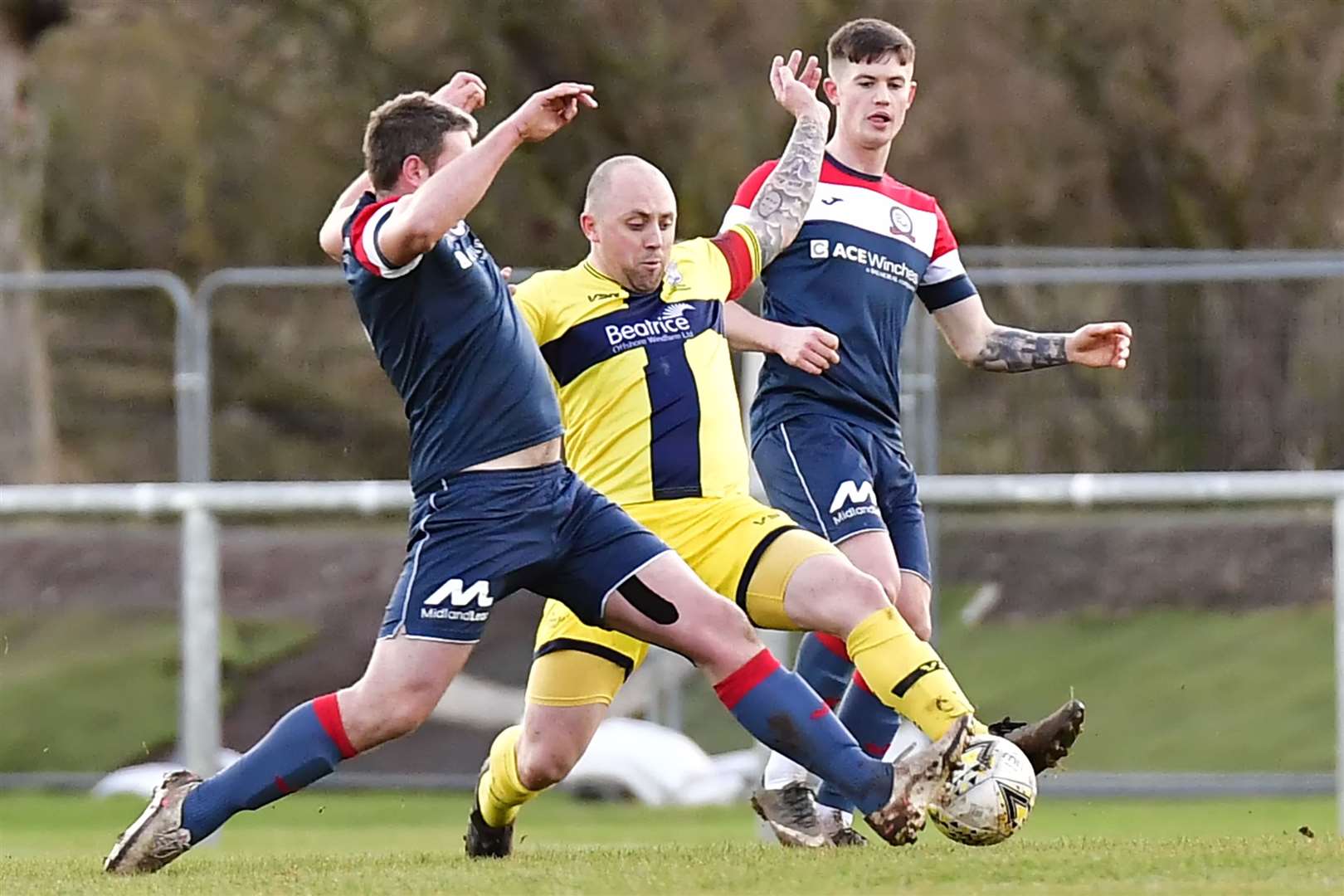 Wick Academy's Danny Mackay and Turriff's Matty McDonald stretch for the ball. Picture: Mel Roger