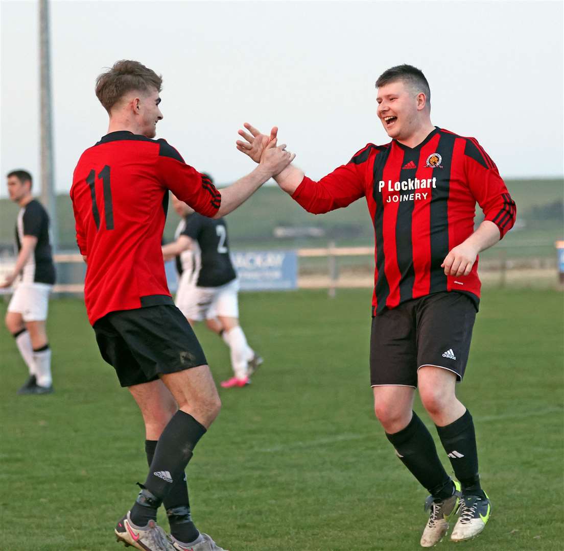 Alan Larnach (right) is congratulated by Owen Cannop after scoring the fifth goal for Halkirk. Picture: James Gunn