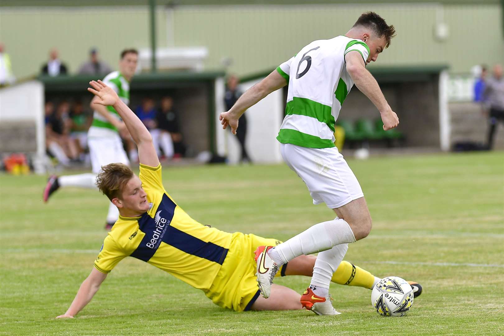 Mark Macadie of Wick Academy at full stretch to tackle Buckie's Jack Murray during the opening Highland League match at Victoria Park last weekend. Picture: Mel Roger