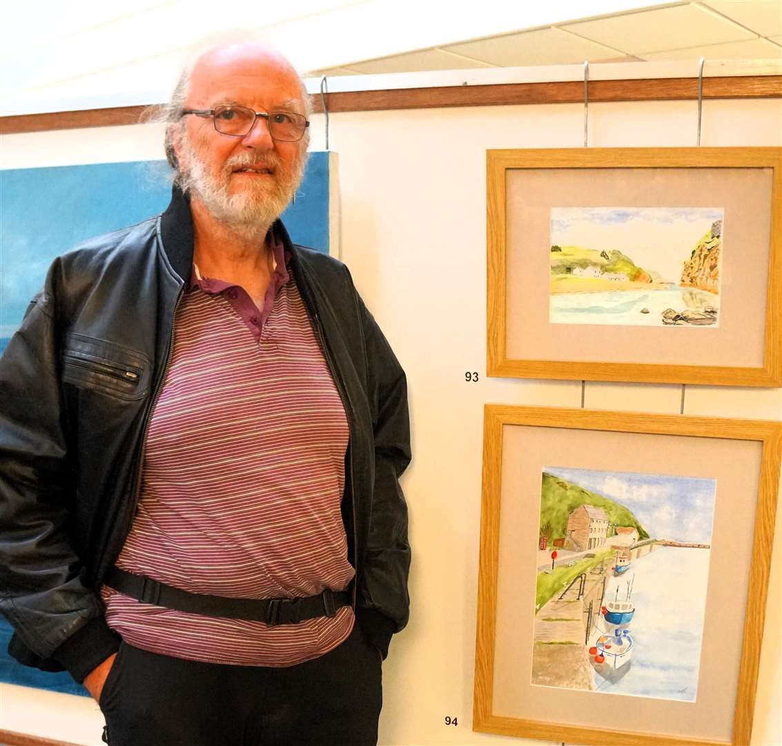 Mike Grain with two local harbour scenes in watercolour. Picture: DGS