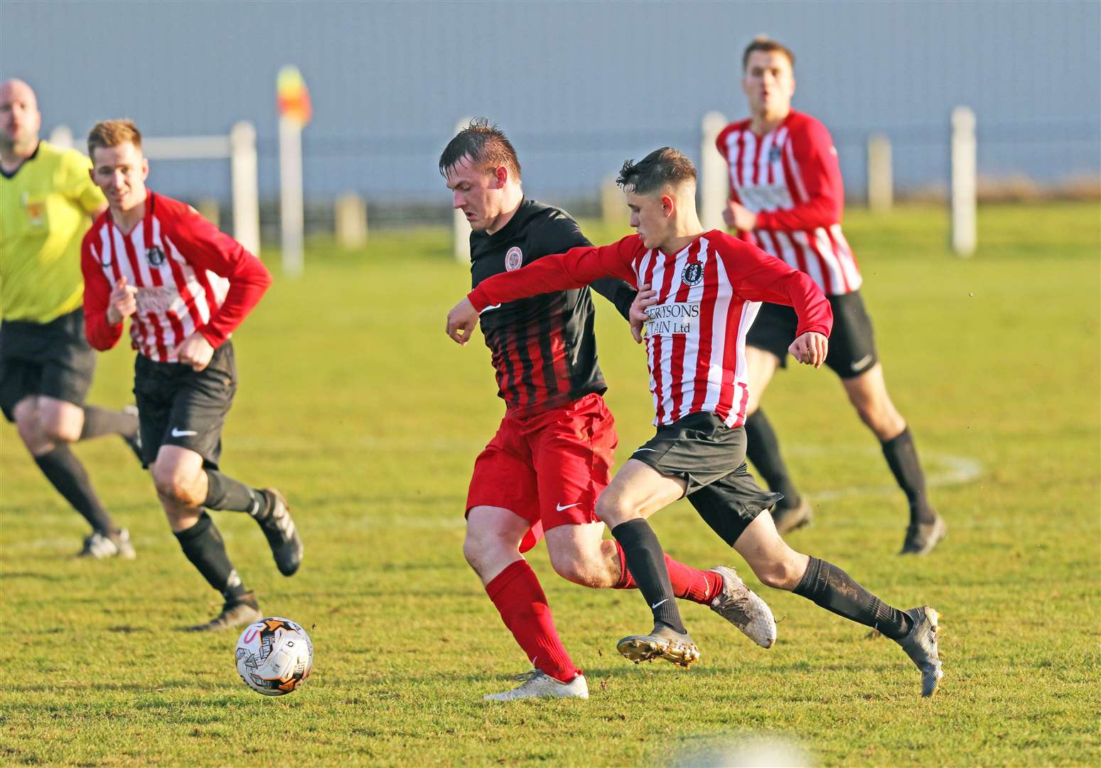 Halkirk United's Andy Mackay in a tussle for the ball during the defeat to St Duthus on Saturday. Picture: James Gunn