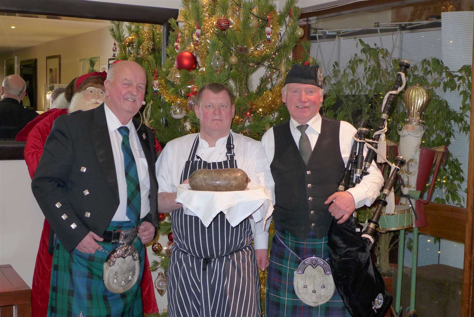 Willie Mackay, chef Andrew Munro, and piper Alistair Miller before going into the anniversary dinner at the Norseman Hotel.