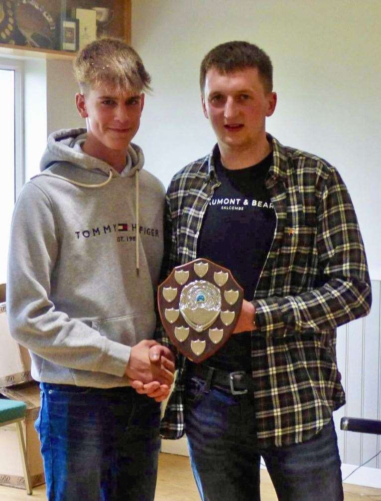 Junior champion Ryan Henderson (left) with club chairman Jamie Morris.